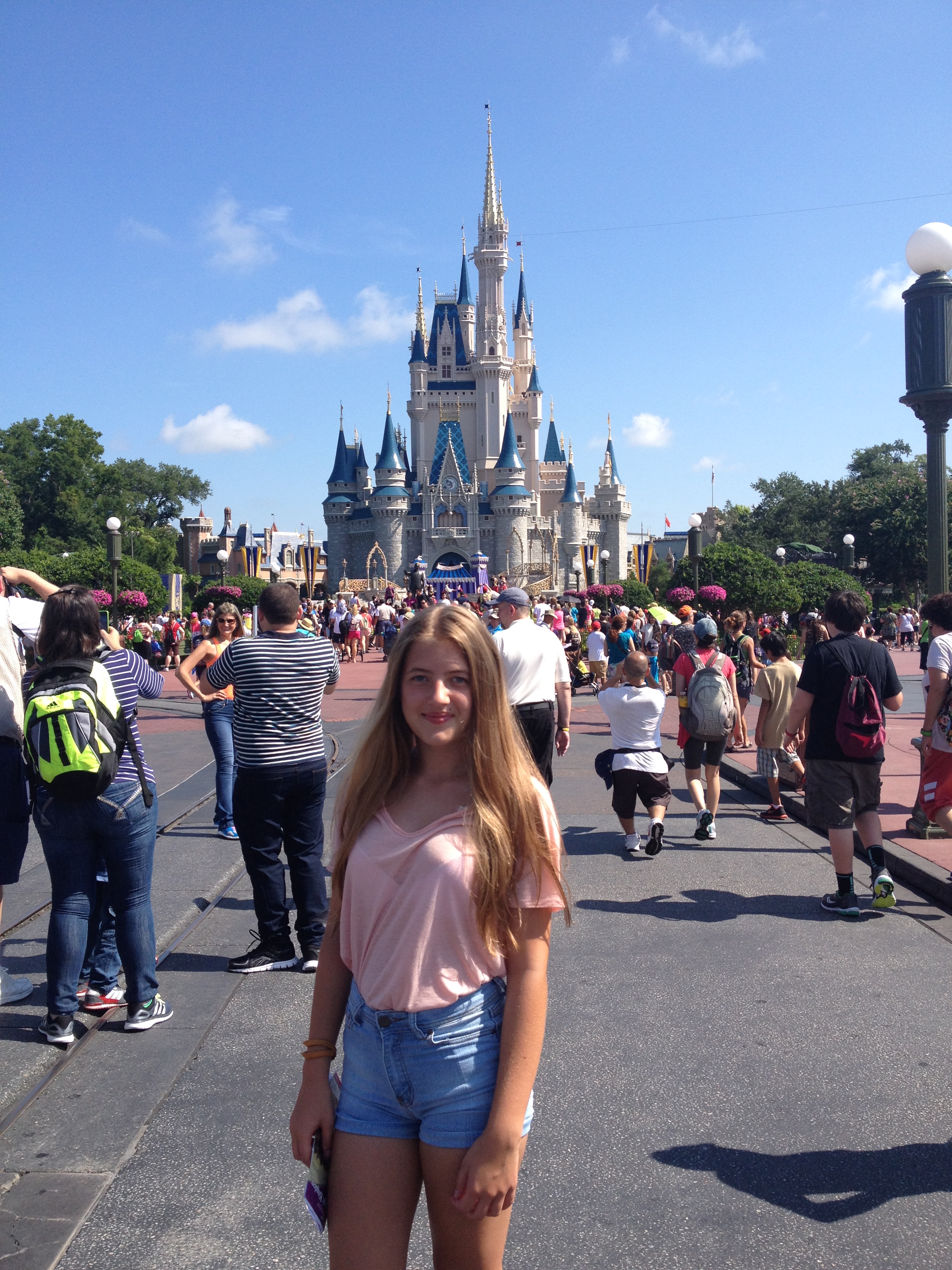 This image is an image of me in front of the castel at Disney Land